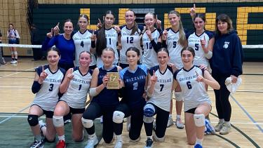 A picture of the tournament winners from the Jr. Girls Volleyball team 