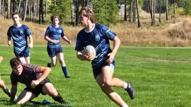 An LVR rugby player carrying the ball
