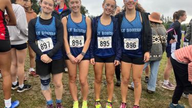 A picture of the bronze medal girls cross-country team 