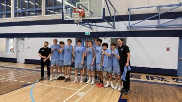 A pic of the Sr. Boys basketball team tournament winning team